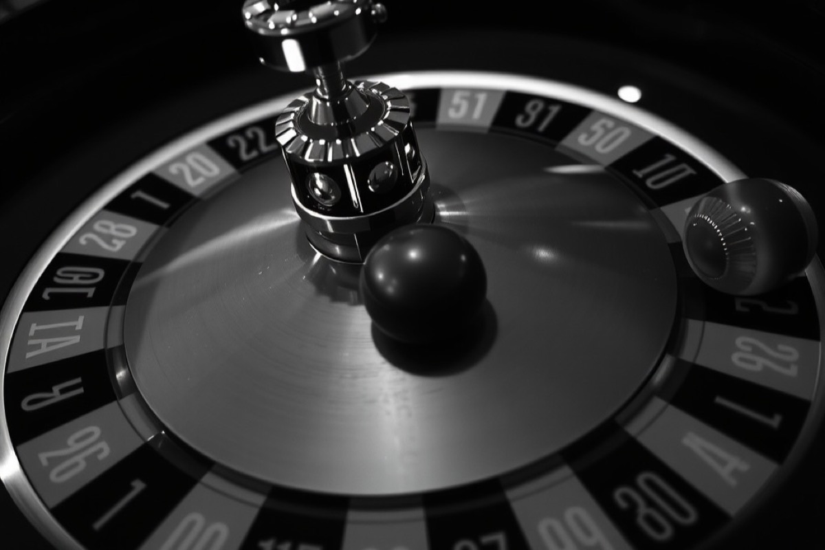 A roulette ball resting in a pocket of the wheel
